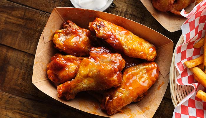 Basket of bone in chicken wings tossed in bbq sauce served at the Rockin Chicken Shack restaurant in Wisconsin Dells.